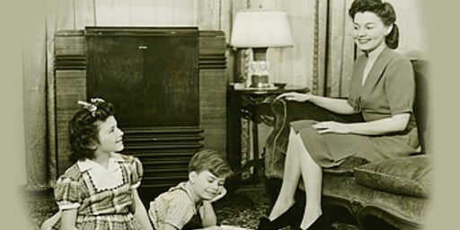 black and white photo - lady talking to kids