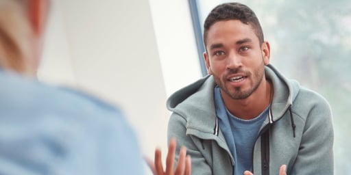counsellor in conversation with young adult