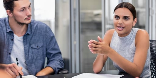 employees talking around table