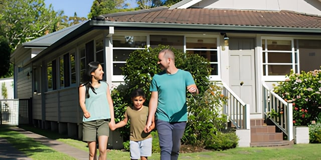 happy family walking outside home