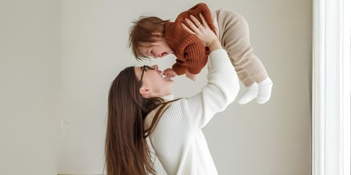 happy mom holding baby high