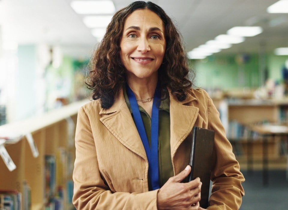 happy-school-leader-with-folder-in-hand