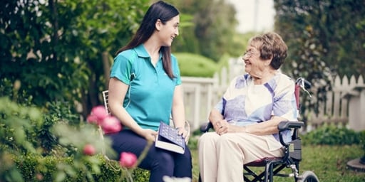 home care support worker helping at home australian on wheel chair