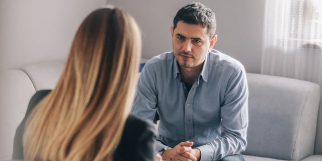male parent in counselling session with a counsellor
