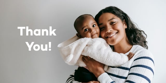 mother holding baby with thank you message