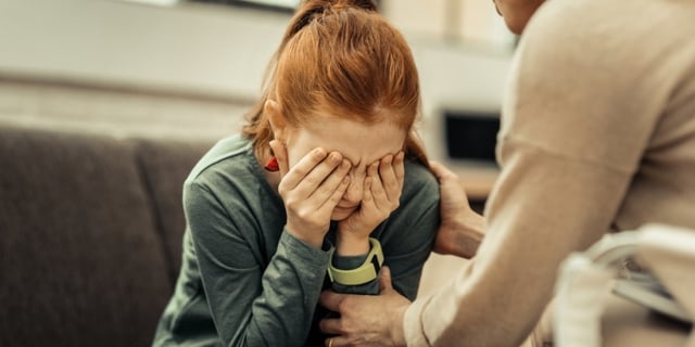 sad-kid-receiving-counselling