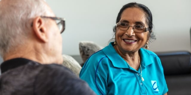 support worker talking to client