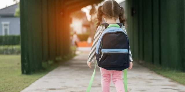 walking-young-kid-with-school-bag
