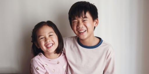 young kids brother sister laughing