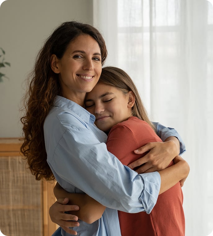Two persons sharing a hug