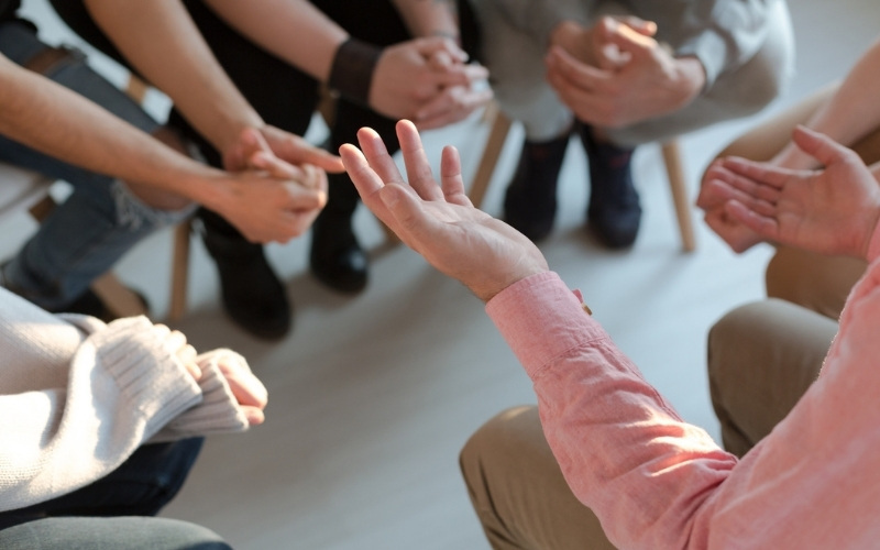 group with open hands available for support