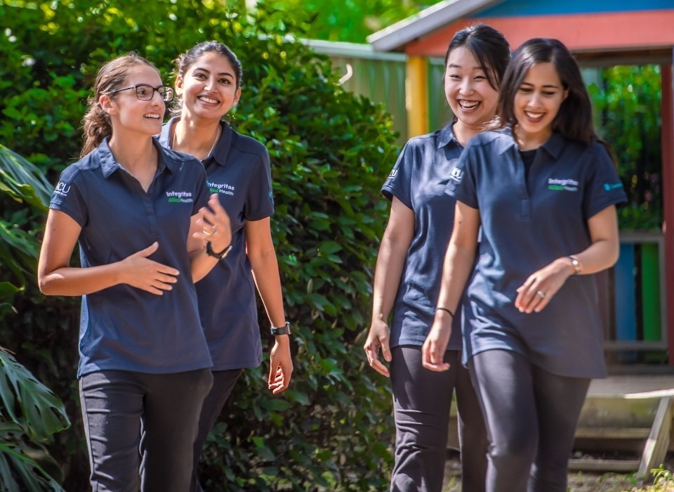 integritas allied health team laughing walking