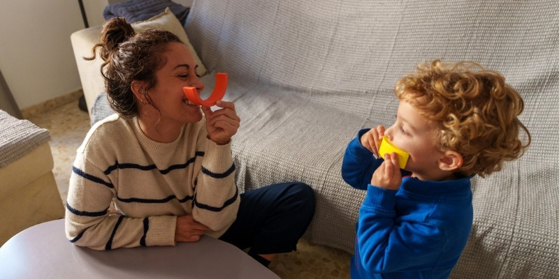 mother playing with son