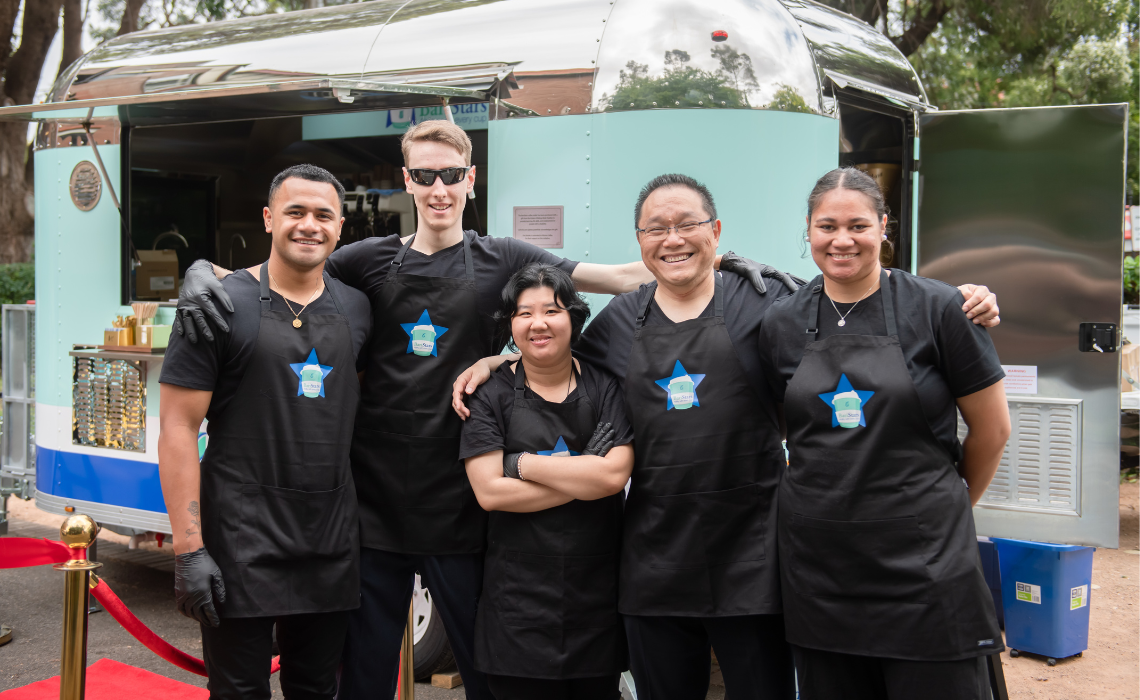 BariStars team are all smiles at the grand opening of CatholicCare's new mobile cafe