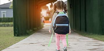 Young girl walking home alone